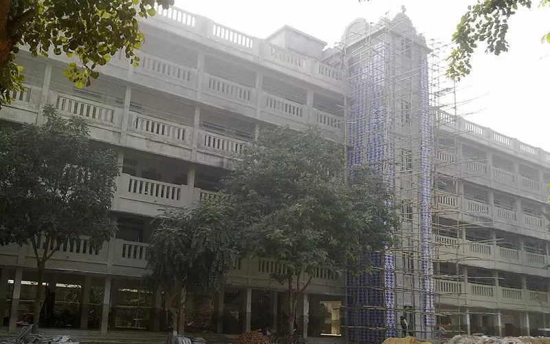 Building under construction with scaffolding in Patna